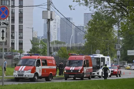 Police and emergency vehicles parked at the side of the wreckage of the drone fell near the Karamyshevskaya embankment to the after a reported drone attack in Moscow, Russia, on Friday, Aug. 11, 2023. The Mayor of Moscow, Sergei Sobyanin said a drone fell in western Moscow after it was shot down by air defense systems. Sobyanin said no-one was hurt when the drone fell near Karamyshevskaya embankment and that no serious damage was caused. Russian social media channels shared videos of what they s