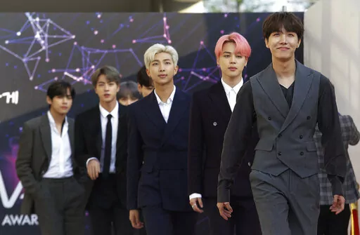 FILE -In this April 24, 2019, photo, members of South Korean K-Pop group BTS arrive to attend The Fact Music Awards in Incheon, South Korea. BTS will reveal their gradual journey to becoming K-pop superstars through a new Apple Music weekly limited series. The streaming service announced Thursday, May 26, 2022 that BTS will launch their new show “BTS Radio: Past & Present” on Apple Music 1. (AP Photo/Ahn Young-joon, File)