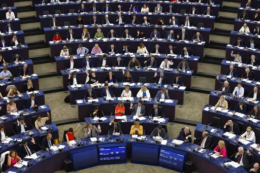 European lawmakers vote on climate change issues at the European Parliament in Strasbourg, eastern France, Tuesday, Sept. 13, 2022. European Union lawmakers have backed a proposal for a law that would ban the sale in the 27-nation bloc of agriculture products linked to the destruction of forests. (AP Photo/Jean-Francois Badias)