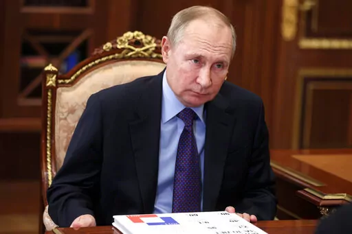 Russian President Vladimir Putin listens during a meeting in Moscow, Russia, Thursday, Dec. 30, 2021. (Alexei Nikolsky, Sputnik, Kremlin Pool Photo via AP)