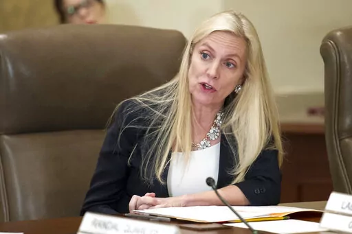 FILE- In this June 14, 2018, file photo Federal Reserve Board Governor Lael Brainard participates in an open meeting in Washington.  The U.S. Senate on Tuesday, April 26, 2022 approved Brainard to a four-year term as vice chair of the Federal Reserve, elevating her to a top policymaking position in the midst of the central bank's toughest fight against inflation in four decades.   (AP Photo/Cliff Owen, File)