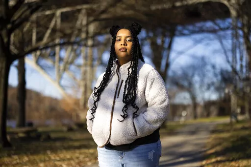 High school student Mecca Patterson-Guridy, 17, poses for a portrait in Philadelphia, Friday, Dec. 9, 2022. Scrutiny from conservatives around teaching about race, gender and sexuality has made many teachers reluctant to discuss issues that touch on cultural divides. To fill in gaps, some students, including Mecca, are looking to social media, where online personalities, nonprofit organizations and teachers are experimenting with ways to connect with them outside the confines of school. (AP Phot
