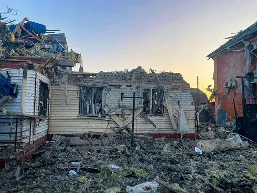 This photo released by the acting Governor of Kursk region Alexei Smirnov telegram channel , shows a damaged house after shelling by the Ukrainian side in the city of Sudzha, Kursk region that borders Ukraine, Tuesday, Aug. 6, 2024. Russian officials said Wednesday they were fighting off Ukrainian cross-border raids in a southwestern border province for a second day, as Kyiv officials remained quiet about the scope of the operation. (Governor of Kursk region telegram channel via AP)