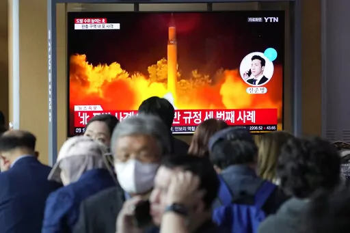A TV screen shows a file image of North Korea's missile launch during a news program at the Seoul Railway Station in Seoul, South Korea, Friday, Oct. 14, 2022. North Korea early Friday launched a short-range ballistic missile toward its eastern waters and flew warplanes near the border with South Korea, further raising animosities triggered by the North's recent barrage of weapons tests. (AP Photo/Ahn Young-joon)