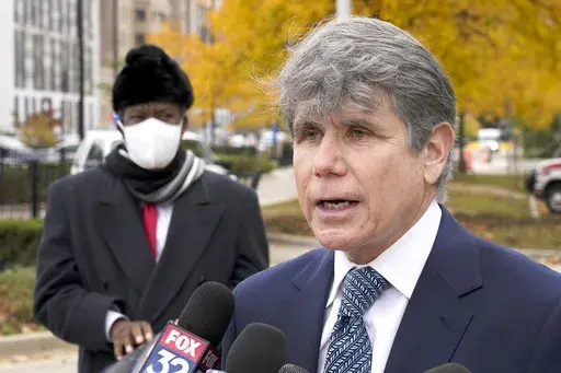 Former Illinois Gov. Rod Blagojevich, right, speaks, Oct. 21, 2020, during a news conference in Chicago. (AP Photo/Charles Rex Arbogast, File)