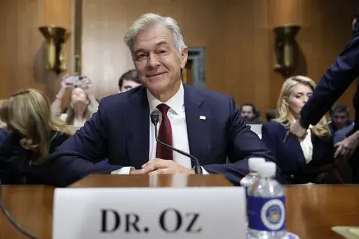 Dr. Mehmet Oz, President Donald Trump's pick to lead the Centers for Medicare and Medicaid Services, sits before testifying at his confirmation hearing before the Senate Finance Committee, on Capitol Hill in Washington, Friday, March 14, 2025. (AP Photo/Ben Curtis)