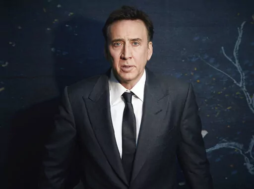 Nicolas Cage poses for a portrait to promote "The Unbearable Weight of Massive Talent" in New York on April 9, 2022. (Photo by Taylor Jewell/Invision/AP)