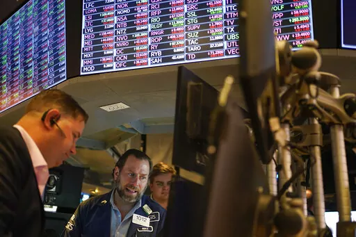 Traders work on the floor at the New York Stock Exchange in New York, May 19, 2022. Stocks are opening lower on Wall Street Tuesday, May 24, 2022 led by drops in tech heavyweights like the parent companies of Facebook and Google. The S&P 500 index fell 1.2% in the early going, and the tech-heavy Nasdaq was down almost twice as much, 2.3%. (AP Photo/Seth Wenig)