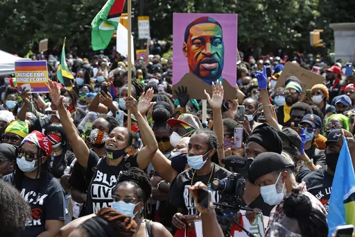 People participate in a Caribbean-led Black Lives Matter rally on June 14, 2020, at Brooklyn's Grand Army Plaza in New York. On Wednesday, July 19, 2023, New York City agreed to pay more than $13 million to settle a civil rights lawsuit brought on behalf of roughly 1,300 people who were arrested or beaten by police during racial injustice demonstrations that swept through the city during the summer of 2020. (AP Photo/Kathy Willen, File)