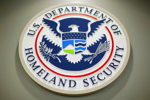 The Department of Homeland Security logo is seen during a news conference in Washington, Feb. 25, 2015. DHS says a looming Supreme Court decision on abortion, an increase of migrants at the U.S.-Mexico border and the midterm elections are potential triggers for extremist violence over the next six months. DHS said June 7, 2022, in the National Terrorism Advisory System bulletin the U.S. was in a "heightened threat environment" already and these factors may worsen the situation. (AP Photo/Pablo M