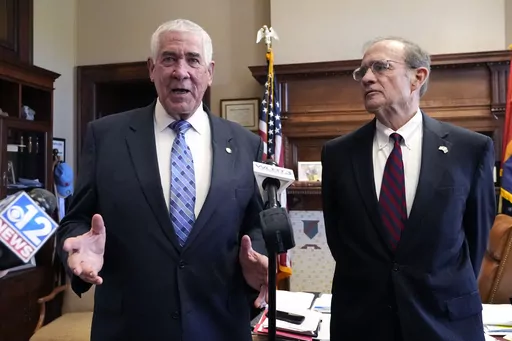 Mississippi Republican Lt. Gov. Delbert Hosemann, right, listens as Senate Medicaid Committee Chairman Sen. Kevin Blackwell, R-Southaven, provides details on the body's passing a Medicaid expansion bill at the state Capitol in Jackson, Miss., Thursday, March 28, 2024. (AP Photo/Rogelio V. Solis)