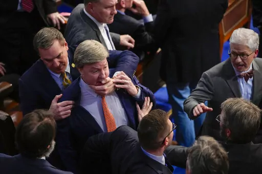 Rep. Richard Hudson, R-N.C., left, pulls Rep. Mike Rogers, R-Ala., back as they talk with Rep. Matt Gaetz, R-Fla., and others during the 14th round of voting for speaker as the House meets for the fourth day to try and elect a speaker and convene the 118th Congress in Washington, Friday, Jan. 6, 2023. At right is Rep. Patrick McHenry, R-N.C. (AP Photo/Andrew Harnik)