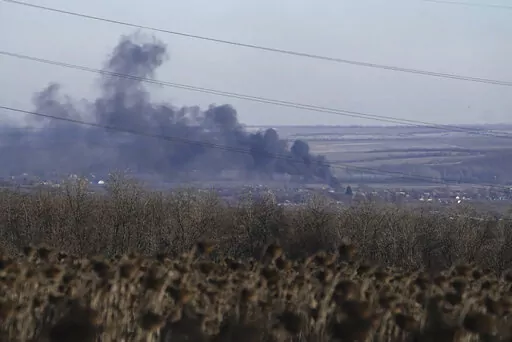 Smoke billows during fighting between Ukrainian and Russian forces in Soledar, Donetsk region, Ukraine, Wednesday, Jan. 11, 2023. Soledar and Bakhmut again highlighted a bitter rift between the top military brass and Yevgeny Prigozhin, a rogue millionaire whose Wagner Group military contractor has played an increasing role in Ukraine. (AP Photo/Libkos, File)