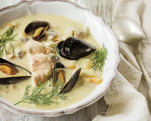 This image shows a recipe for creamy seafood chowder, from Imen McDonnell's “The Farmette Cookbook: Recipes and Adventures from My Life on an Irish Farm.” (Imen McDonnell via AP)