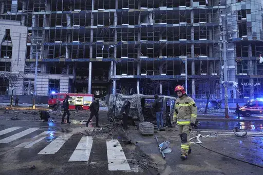 First responders work the scene following a Russian missile attack in Kyiv, Ukraine, Saturday, Jan. 18, 2025. (AP Photo/Efrem Lukatsky)
