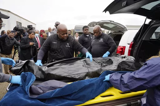 Westhaven Memorial Funeral Home staff adjust the body bag with the remains of Dexter Wade, who died after being hit by a Jackson, Miss., police SUV driven by an off-duty officer, in Raymond, Miss., Nov. 13, 2023. A third family says they recently discovered a relative was buried in a Mississippi pauper’s cemetery without their knowledge. Civil rights attorney Ben Crump says it is the latest case in which families learned the whereabouts of a deceased loved one from news reports instead of from